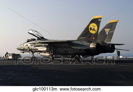 An F-14D Tomcat on the flight deck of USS Theodore Roosevelt. View Large Photo Image Picture - An F-14D Tomcat on the flight deck of USS Theodore Roosevelt.. Fotosearch