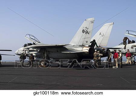 An F-14D Tomcat on the flight deck of USS Theodore Roosevelt. View Large Photo Image Picture - An F-14D Tomcat on the flight deck of USS Theodore Roosevelt.. Fotosearch