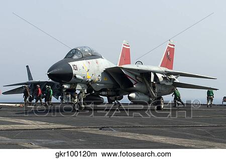 An F-14D Tomcat on the flight deck of USS Theodore Roosevelt. View Large Photo Image Picture - An F-14D Tomcat on the flight deck of USS Theodore Roosevelt.. Fotosearch