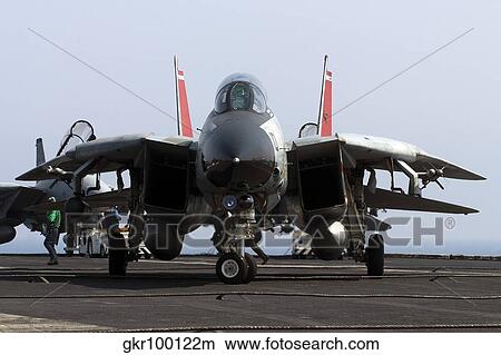An F-14D Tomcat on the flight deck of USS Theodore Roosevelt. View Large Photo Image Picture - An F-14D Tomcat on the flight deck of USS Theodore Roosevelt.. Fotosearch