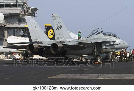 An F-14D Tomcat on the flight deck of USS Theodore Roosevelt. View Large Photo Image Picture - An F-14D Tomcat on the flight deck of USS Theodore Roosevelt.. Fotosearch