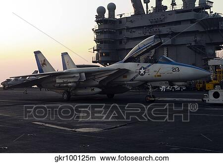 An F-14D Tomcat on the flight deck of USS Theodore Roosevelt. View Large Photo Image Picture - An F-14D Tomcat on the flight deck of USS Theodore Roosevelt.. Fotosearch