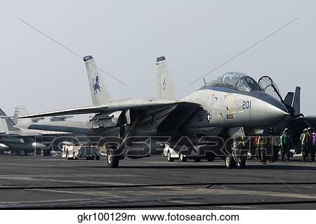An F-14D Tomcat on the flight deck of USS Theodore Roosevelt. View Large Photo Image Picture - An F-14D Tomcat on the flight deck of USS Theodore Roosevelt.. Fotosearch