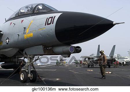 An F-14D Tomcat on the flight deck of USS Theodore Roosevelt. View Large Photo Image Picture - An F-14D Tomcat on the flight deck of USS Theodore Roosevelt.. Fotosearch