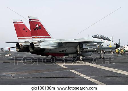 An F-14D Tomcat on the flight deck of USS Theodore Roosevelt. View Large Photo Image Picture - An F-14D Tomcat on the flight deck of USS Theodore Roosevelt.. Fotosearch