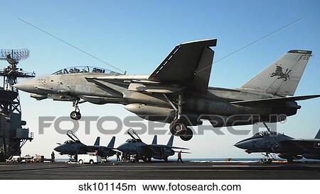 An F-14D Tomcat prepares to land on the flight deck of USS Theodore Roosevelt. View Large Photo Image Picture - An F-14D Tomcat prepares to land on the flight deck of USS Theodore Roosevelt.. Fotosearch