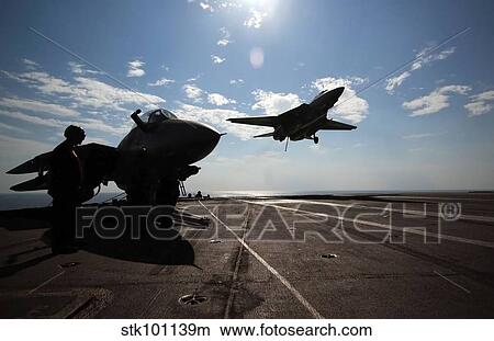 An F-14D Tomcat prepares to make an arrested landing aboard USS Theodore Roosevelt. View Large Photo Image Picture - An F-14D Tomcat prepares to make an arrested landing aboard USS Theodore Roosevelt.. Fotosearch