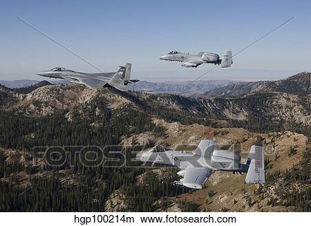 An F-15 Eagle and two A-10 Thunderbolt's in flight over Central Idaho. View Large Photo Image Picture - An F-15 Eagle and two A-10 Thunderbolt's in flight over Central Idaho.. Fotosearch