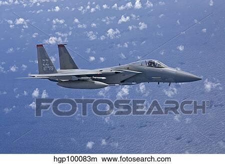 An F-15 Eagle flies over the Pacific Ocean during a training mission. View Large Photo Image Picture - An F-15 Eagle flies over the Pacific Ocean during a training mission.. Fotosearch