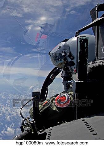 An F-15 Eagle pilot flies in formation with his wingman. View Large Photo Image Picture - An F-15 Eagle pilot flies in formation with his wingman.. Fotosearch