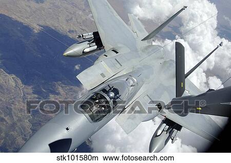 Picture - An F-15 Eagle pulls away from a KC-135 Stratotanker after refueling.. Fotosearch