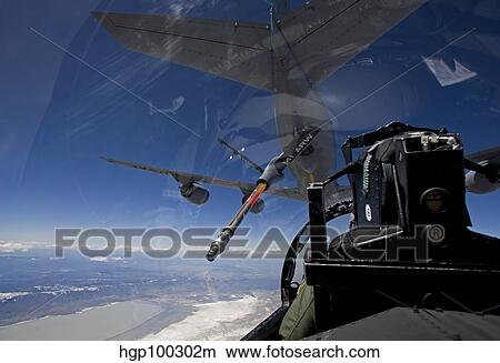 An F-15 Eagle pulls into position behind a KC-135 Stratotanker View Large Photo Image Picture - An F-15 Eagle pulls into position behind a KC-135 Stratotanker. Fotosearch