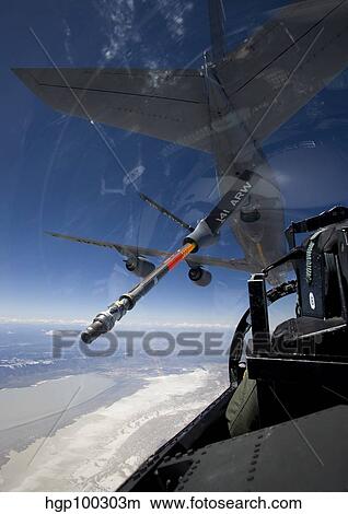 An F-15 Eagle pulls into position behind a KC-135 Stratotanker View Large Photo Image Picture - An F-15 Eagle pulls into position behind a KC-135 Stratotanker. Fotosearch