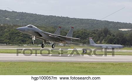 An F-15 Eagle takes off from Kadena Air Base, Okinawa, Japan. View Large Photo Image Picture - An F-15 Eagle takes off from Kadena Air Base, Okinawa, Japan.. Fotosearch