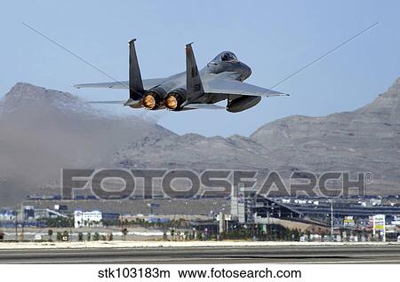 An F-15 Eagle taking off for a Red Flag 09-5 training mission at Nellis Air Force Base, Nevada. View Large Photo Image Picture - An F-15 Eagle taking off for a Red Flag 09-5 training mission at Nellis Air Force Base, Nevada. . Fotosearch