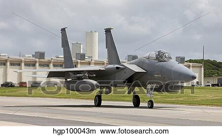 An F-15 Eagle taxi's to the end of runway at Kadena Air Base, Japan. View Large Photo Image Picture - An F-15 Eagle taxi's to the end of runway at Kadena Air Base, Japan.. Fotosearch