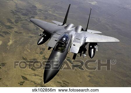 An F-15E Strike Eagle aircraft in flight over Afghanistan. View Large Photo Image Picture - An F-15E Strike Eagle aircraft in flight over Afghanistan.. Fotosearch