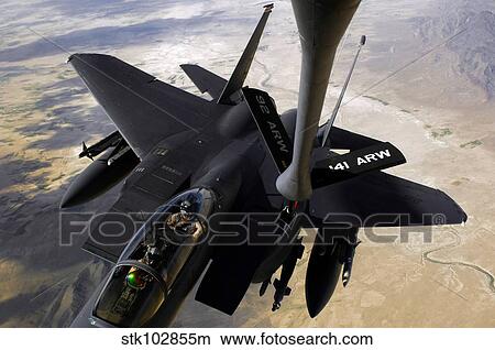 An F-15E Strike Eagle aircraft receives fuel from a KC-135R Stratotanker. View Large Photo Image Picture - An F-15E Strike Eagle aircraft receives fuel from a KC-135R Stratotanker.. Fotosearch
