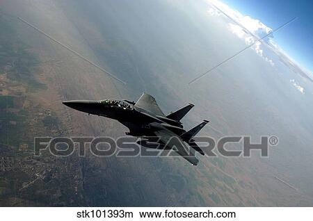 An F-15E Strike Eagle breaks away from a KC-135 Stratotanker after refueling. View Large Photo Image Picture - An F-15E Strike Eagle breaks away from a KC-135 Stratotanker after refueling.. Fotosearch