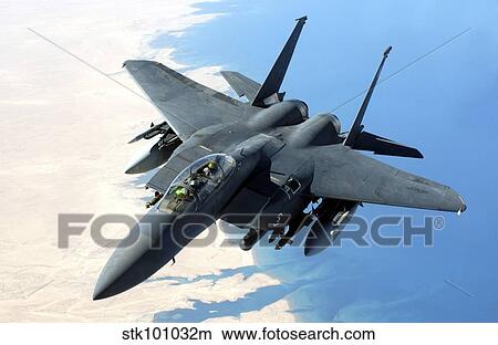 Picture - An F-15E Strike Eagle flies over Iraq during a combat mission.. Fotosearch