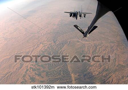 An F-15E Strike Eagle is refueled by a KC-135 Stratotanker. View Large Photo Image Picture - An F-15E Strike Eagle is refueled by a KC-135 Stratotanker.. Fotosearch