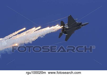 An F-15E Strike Eagle releases flares. View Large Photo Image Picture - An F-15E Strike Eagle releases flares.. Fotosearch