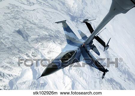 An F-16 Aggressor sits in contact position while a KC-10 Extender off-loads fuel. View Large Photo Image Picture - An F-16 Aggressor sits in contact position while a KC-10 Extender off-loads fuel.. Fotosearch