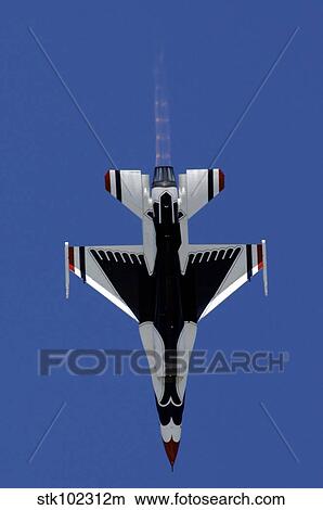 An F-16 Falcon dives straight down while performing the Split S maneuver. View Large Photo Image Picture - An F-16 Falcon dives straight down while performing the Split S maneuver.. Fotosearch