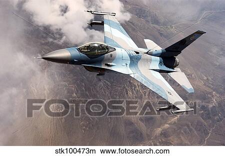An F-16 Falcon in flight. View Large Photo Image Picture - An F-16 Falcon in flight.. Fotosearch