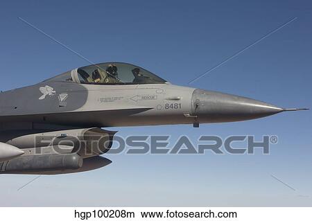 An F-16 Fighting Falcon during a training mission. View Large Photo Image Picture - An F-16 Fighting Falcon during a training mission.. Fotosearch