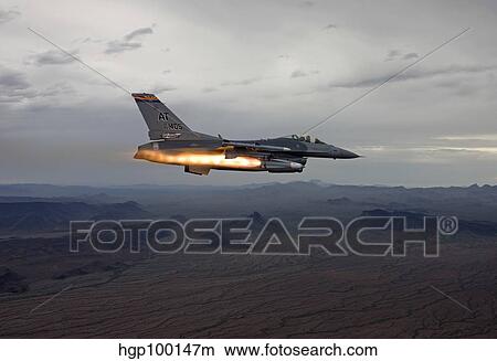 Picture - An F-16 Fighting Falcon fires an AGM-65 Maverick missile.. Fotosearch