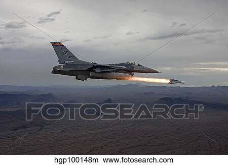 An F-16 Fighting Falcon fires an AGM-65 Maverick missile. View Large Photo Image Picture - An F-16 Fighting Falcon fires an AGM-65 Maverick missile.. Fotosearch