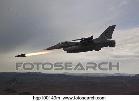 An F-16 Fighting Falcon fires an AGM-65 Maverick missile. View Large Photo Image Picture - An F-16 Fighting Falcon fires an AGM-65 Maverick missile.. Fotosearch