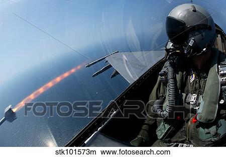 An F-16 Fighting Falcon fires an AIM-9 missile. View Large Photo Image Picture - An F-16 Fighting Falcon fires an AIM-9 missile.. Fotosearch