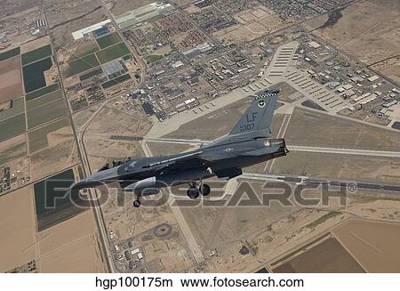 Picture - An F-16 Fighting Falcon in flight over Luke Air Force Base, Arizona.. Fotosearch