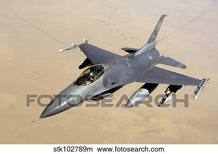 An F-16 Fighting Falcon in flight over Iraq. View Large Photo Image Picture - An F-16 Fighting Falcon in flight over Iraq.. Fotosearch