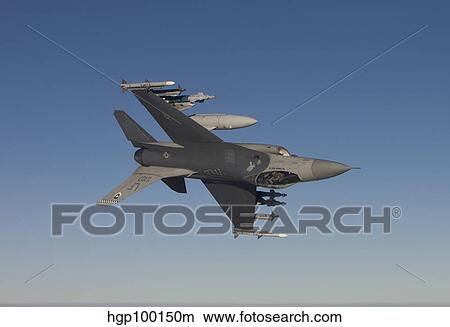 Picture - An F-16 Fighting Falcon manuevers during a training mission.. Fotosearch