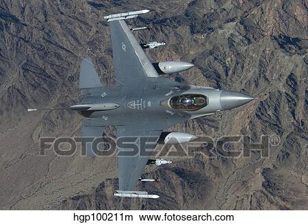 An F-16 Fighting Falcon on a training mission over Arizona. View Large Photo Image Picture - An F-16 Fighting Falcon on a training mission over Arizona.. Fotosearch