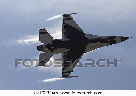 An F-16 Fighting Falcon pulls high G's. View Large Photo Image Picture - An F-16 Fighting Falcon pulls high G's.. Fotosearch
