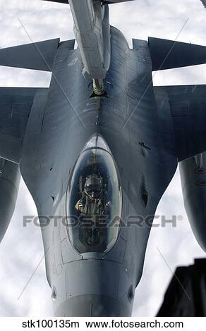 An F-16 Fighting Falcon receives fuel from a KC-10A Extender. View Large Photo Image Picture - An F-16 Fighting Falcon receives fuel from a KC-10A Extender.. Fotosearch