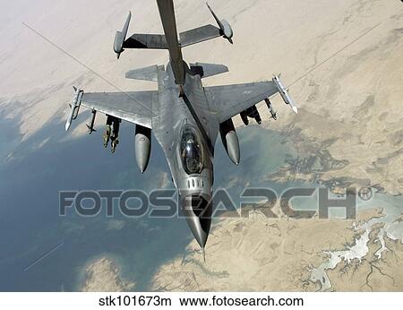 An F-16 Fighting Falcon refuels from a KC-10 Extender. View Large Photo Image Picture - An F-16 Fighting Falcon refuels from a KC-10 Extender.. Fotosearch
