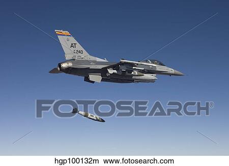 An F-16 Fighting Falcon releases a GBU-31 JDAM View Large Photo Image Picture - An F-16 Fighting Falcon releases a GBU-31 JDAM. Fotosearch