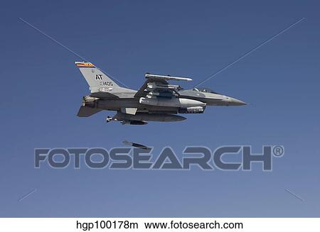 An F-16 Fighting Falcon releases a GBU-38 JDAM during a test mission. View Large Photo Image Picture - An F-16 Fighting Falcon releases a GBU-38 JDAM during a test mission.. Fotosearch