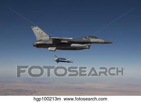An F-16 Fighting Falcon releases two GBU-12 laser guided bombs. View Large Photo Image Picture - An F-16 Fighting Falcon releases two GBU-12 laser guided bombs.. Fotosearch