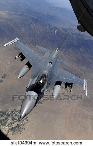 An F-16 Fighting Falcon returns to mission after refueling from a KC-135 Stratotanker. View Large Photo Image Picture - An F-16 Fighting Falcon returns to mission after refueling from a KC-135 Stratotanker.. Fotosearch