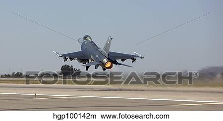Picture - An F-16 Fighting Falcon takes off from Luke Air Force Base, Arizona.. Fotosearch