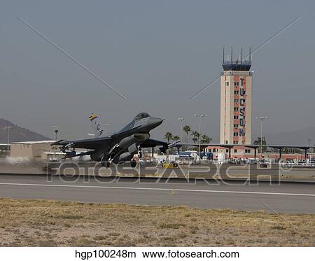 An F-16 Fighting Falcon takes off on a training mission. View Large Photo Image Picture - An F-16 Fighting Falcon takes off on a training mission.. Fotosearch