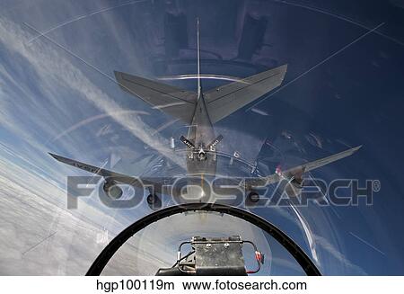 An F-16 flies in the pre-contact position behind a KC-135R Stratotanker. View Large Photo Image Picture - An F-16 flies in the pre-contact position behind a KC-135R Stratotanker.. Fotosearch