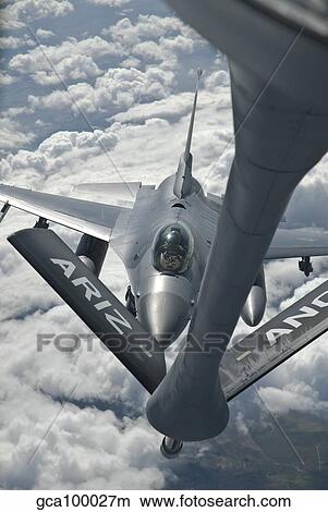 An F-16 from Colorado Air National Guard refuels from a U. S. Air Force KC-135 Stratotanker. View Large Photo Image Picture - An F-16 from Colorado Air National Guard refuels from a U. S. Air Force KC-135 Stratotanker.. Fotosearch