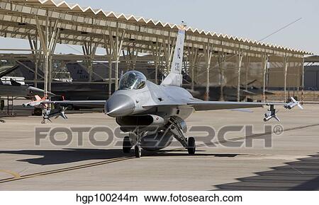 An F-16 pilot taxi's his aircraft at an airbase in Arizona. View Large Photo Image Picture - An F-16 pilot taxi's his aircraft at an airbase in Arizona.. Fotosearch